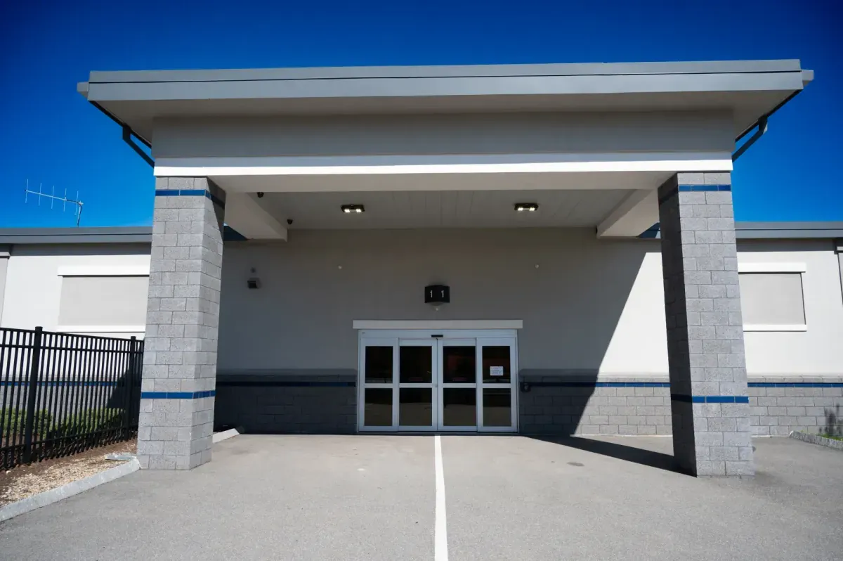 Covered drive-up entrance to Bluebird Self Storage building